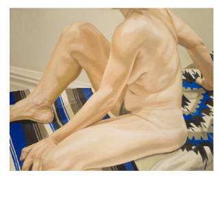 Neck down of a nude body sitting on a black, white, and blue designed blanket