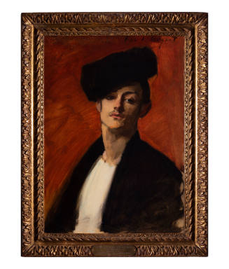 Portrait of a person wearing a black hat and looking straight at us.