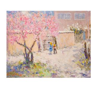 pink flowered tree in front of two people standing at a gate connected to a building
